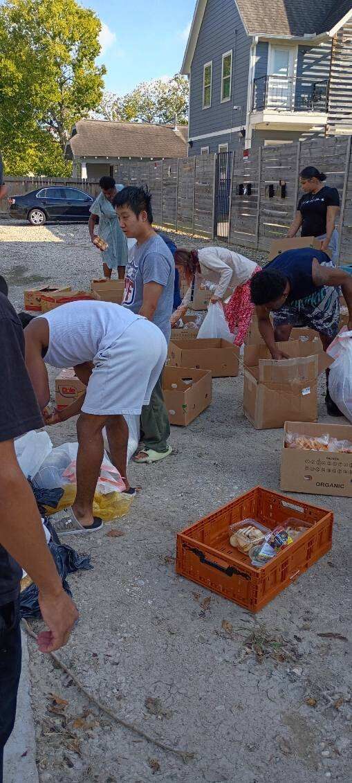 Volunteers sorting donated food