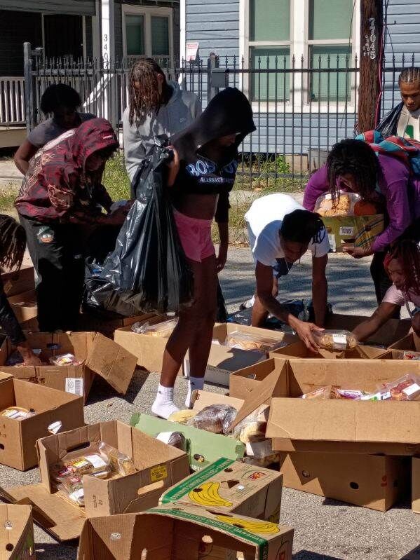A busy street-side food distribution